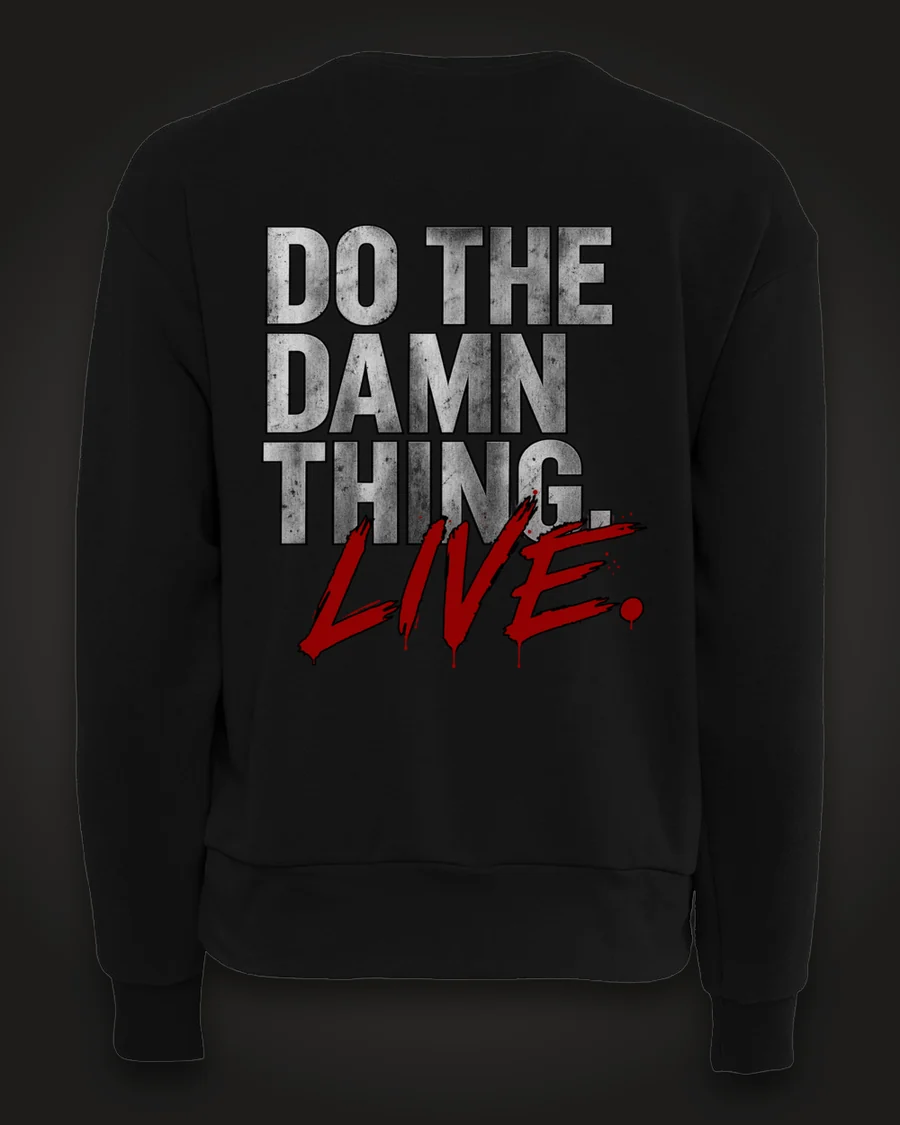 Mockup, back: black women’s crewneck with “Do the damn thing.” in brushed-silver letters with “Live.” brushed across it in red.